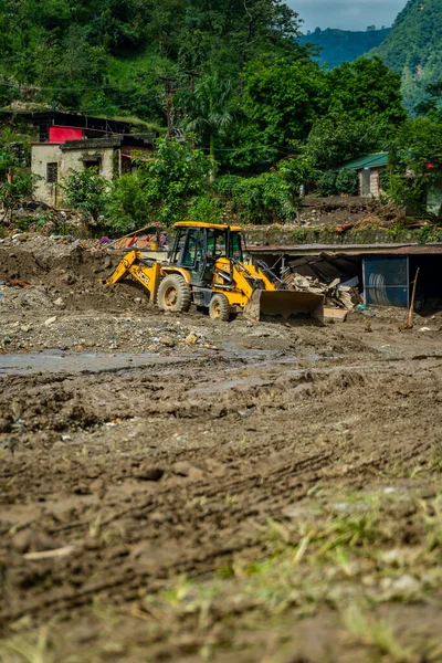 September18th2025 Dehradun Uttarakhand, India. Heavy machines remove rubble in Sahastradhara village after cloudburst floods Badli river, rescue teams search for missing.