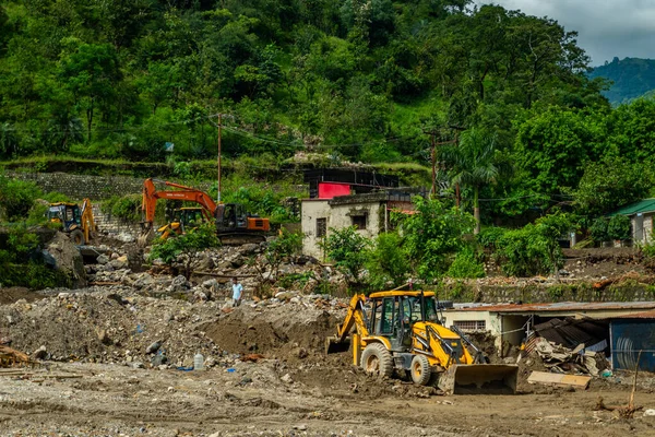September18th2025 Dehradun Uttarakhand, India. Heavy machines remove rubble in Sahastradhara village after cloudburst floods Badli river, rescue teams search for missing.