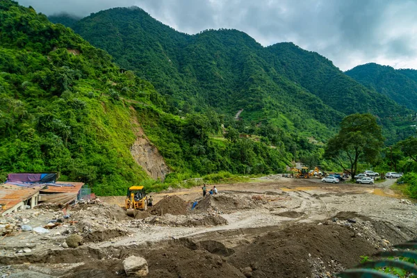 September18th2025 Dehradun Uttarakhand, India. Heavy machines remove rubble in Sahastradhara village after cloudburst floods Badli river, rescue teams search for missing.