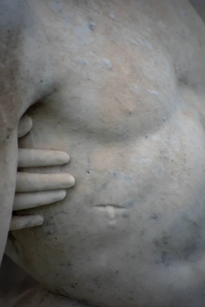 Jesuss wound and Marys hand touching him, stone cemetery statue. — Stock Photo, Image