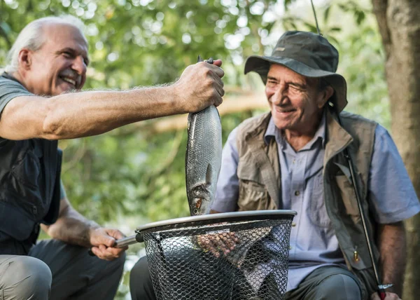 Men Fishing Lake Putting Big Fish Fishing Tackle — Stock Photo, Image