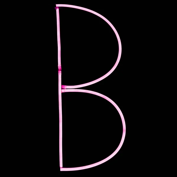 黑色背景上的字母粉红色霓虹灯灯 — 图库照片