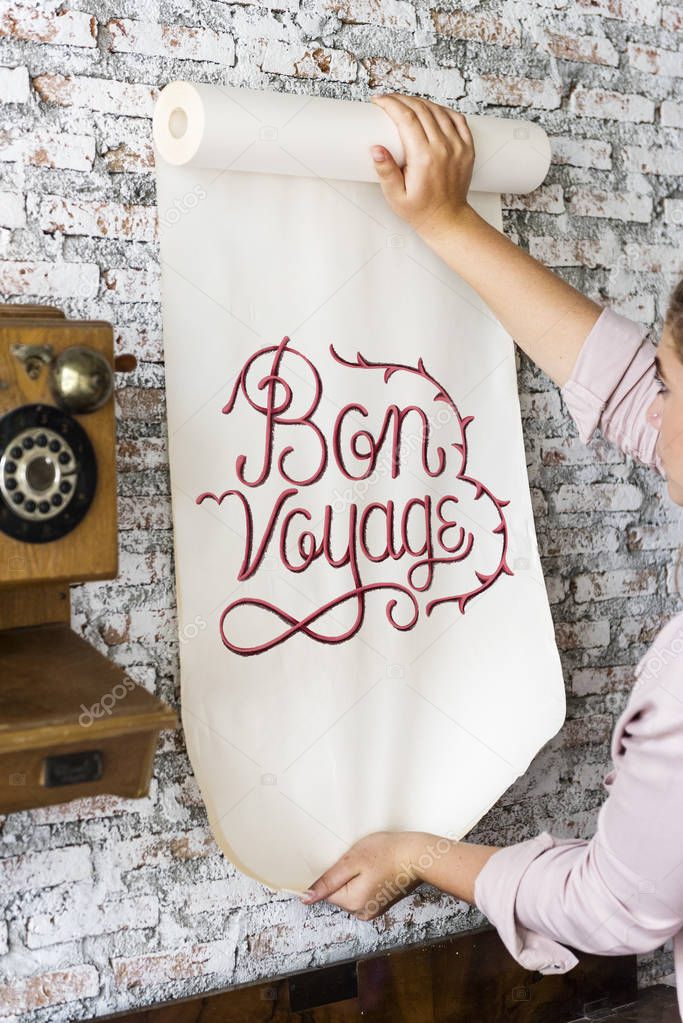 A woman holding a poster with motivation quote