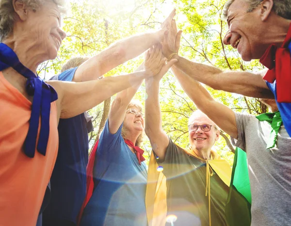 Happy Senior Sportive Friends Giving High Five Park Lens Flare — Stock Photo, Image
