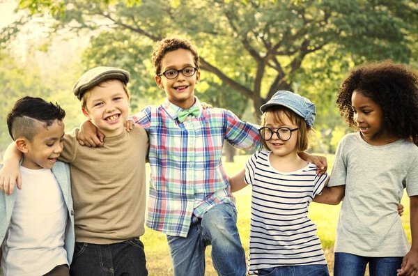 Kids laughing and walking in park 