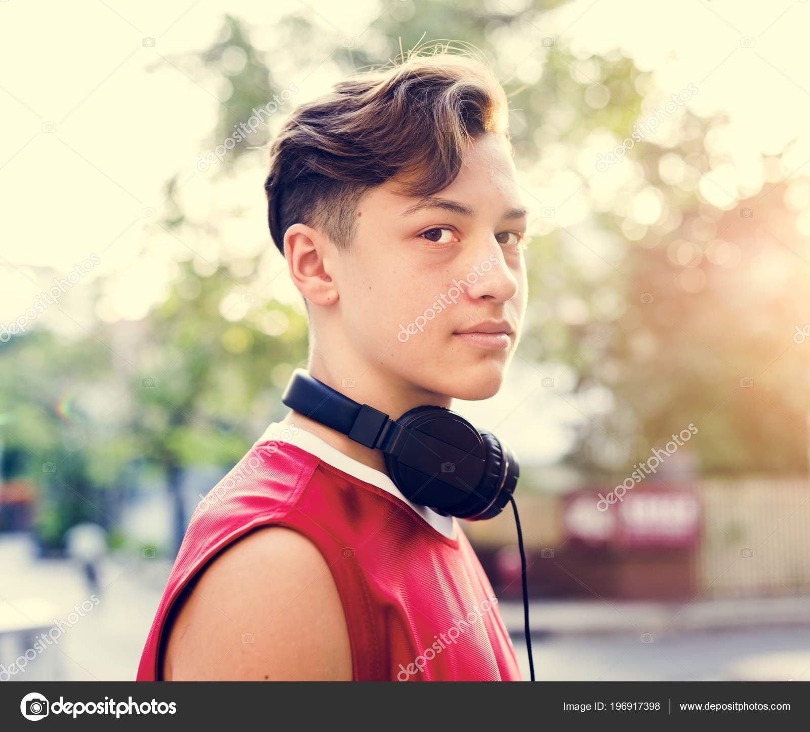 sporty teenage boy outdoors looking camera portrait \u2014 stock photo