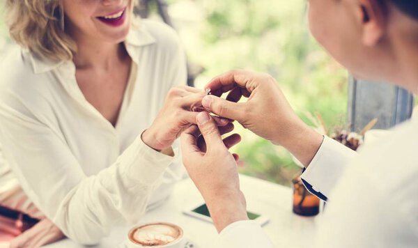 Man proposing girlfriend with diamond ring