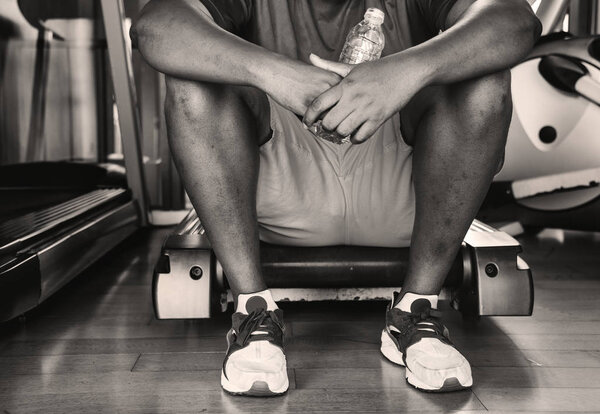 Man taking a break from a workout