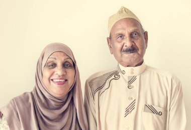 Senior Muslim couple at home clipart