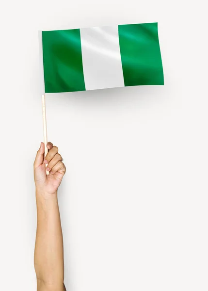 Persona Ondeando Bandera Nigeria — Foto de Stock