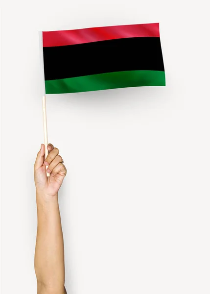 Person Waving Flag Pan African Flag — Stock Photo, Image