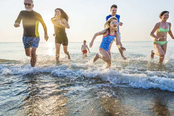 Family playing at the beach