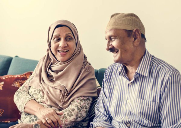 Happy Middle Eastern mature couple at home