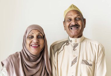 Senior Muslim couple at home clipart
