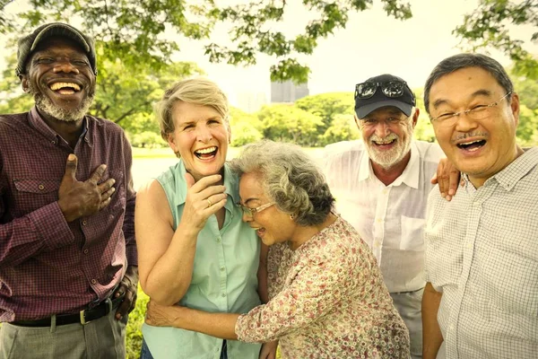 Happy Senior Friends Park Hugging Embracing — Stock Photo, Image