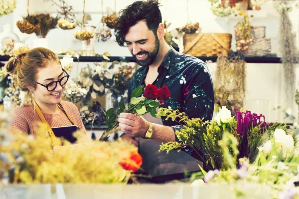 Florists making flower bouquets together