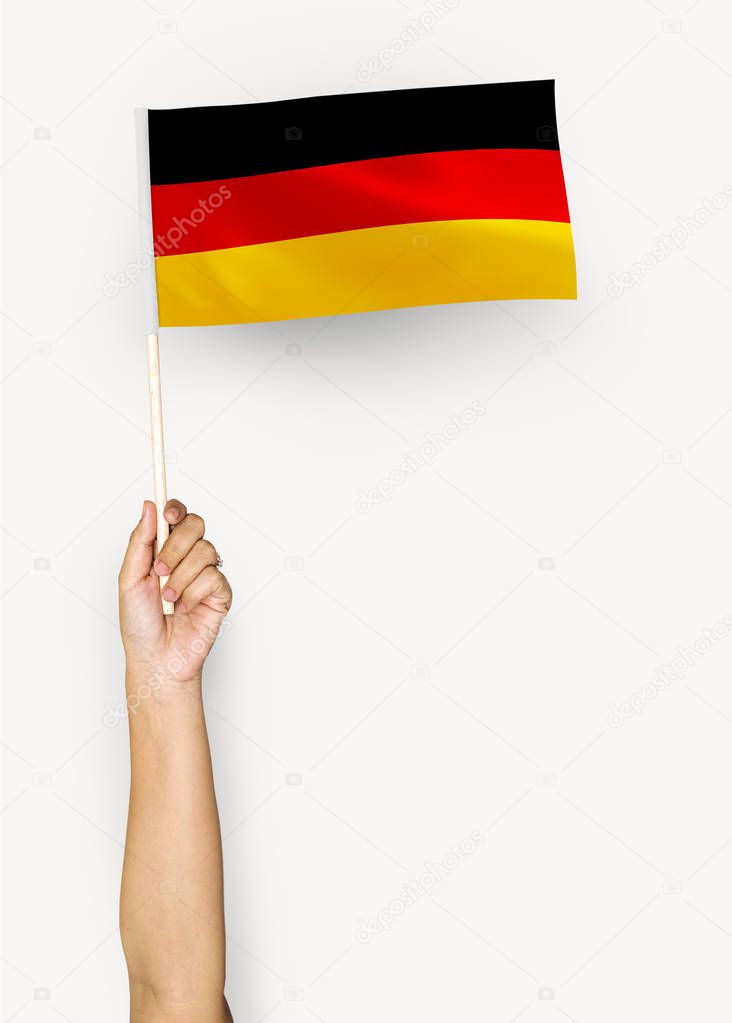 Person waving the flag of Federal Republic of Germany