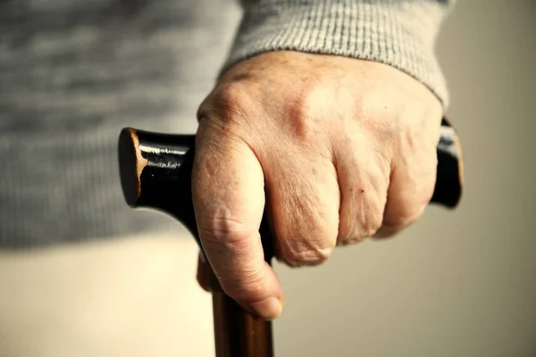 Closeup Elderly Woman Holding Walking Stick — Stock Photo, Image