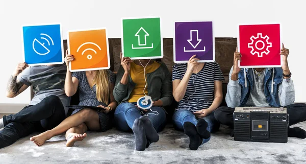 Group Diverse Friends Holding Technology Icons Covering Faces — Stock Photo, Image