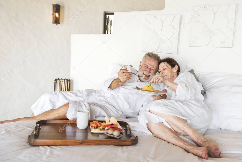 Mature couple in a luxurious hotel room