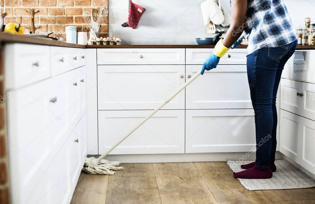 Black woman doing house chores