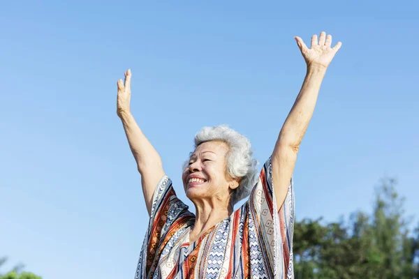 Senior Woman Raising Her Hands — Stock Photo, Image