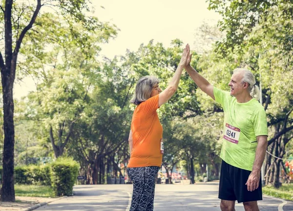 Senior Couple Giving High Five Jogging Park — Stock Photo, Image