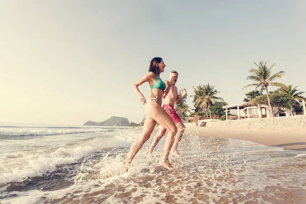 Cheerful Couple Running Shore — Stock Photo, Image