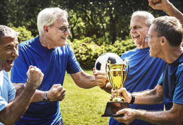 Team Mature Football Players Winning Cup — Stock Photo, Image