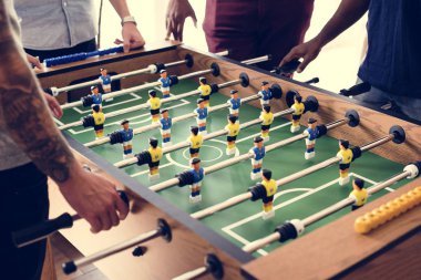People playing table football clipart