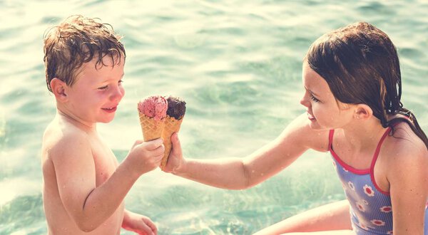 Little kids eating yummy ice cream