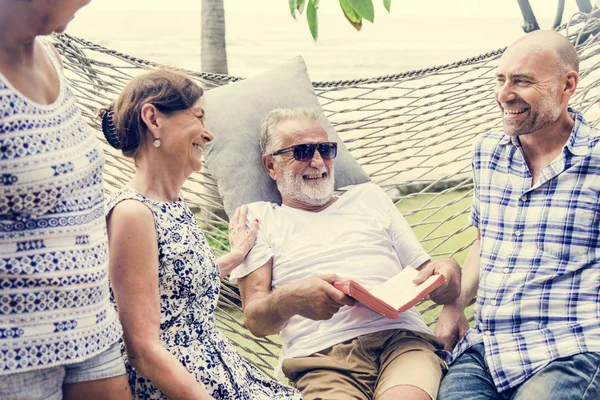 Senior group relaxing in a hammock