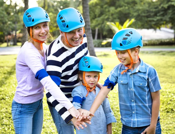 Familia Cascos Bicicleta Azul Posando Con Las Manos Juntas Como —  Fotos de Stock