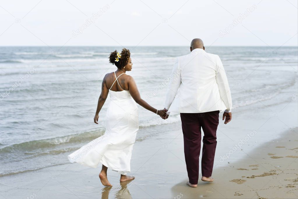 African American couple getting married at an island