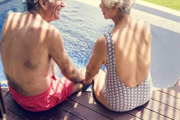 Senior Couple Holding Hands Swimming Pool — Stock Photo, Image