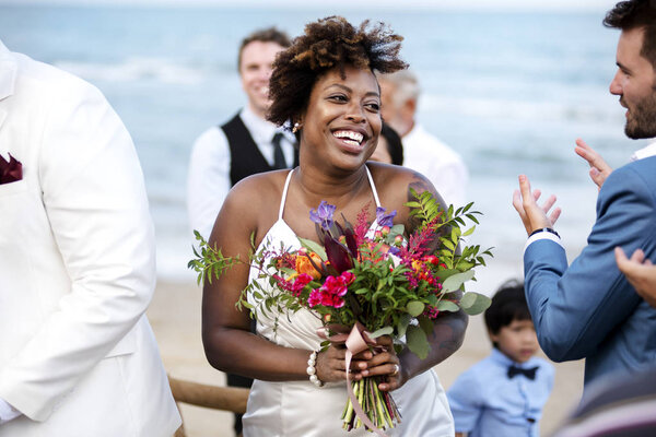 Happy bride and groom in a wedding ceremony at a tropical island