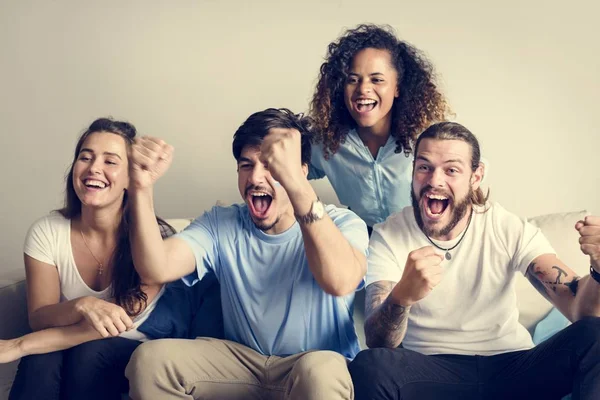 Friends cheering world cup with painted flag