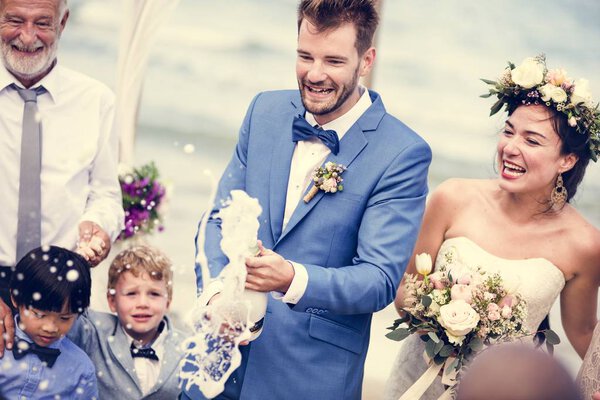 Young couple in a wedding ceremony at the beach