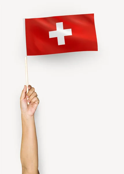 Persona Ondeando Bandera Suiza —  Fotos de Stock