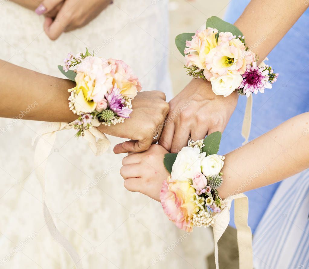 Bridesmaid corsages on hands