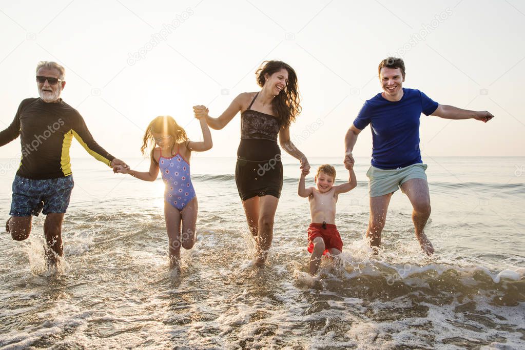 Family playing at the beach