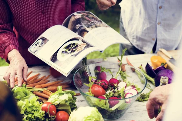 Closeup of hands with cooking book