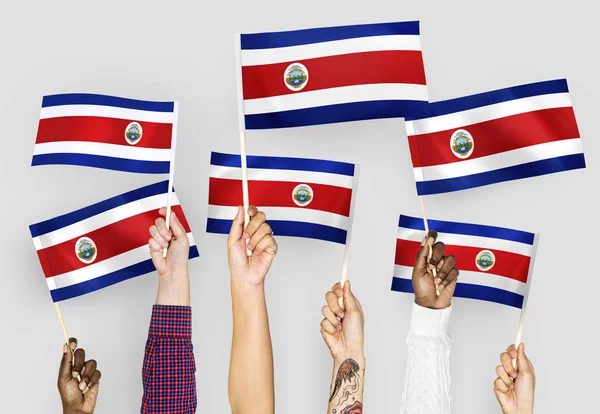 Manos Ondeando Las Banderas Costa Rica — Foto de Stock