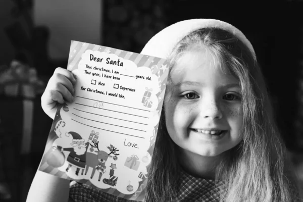 Little Girl Holding Her Christmas Wishlist — Stock Photo, Image