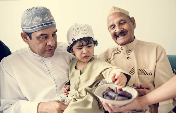 Muslim Boy Eating Dried Dates — Stock Photo, Image