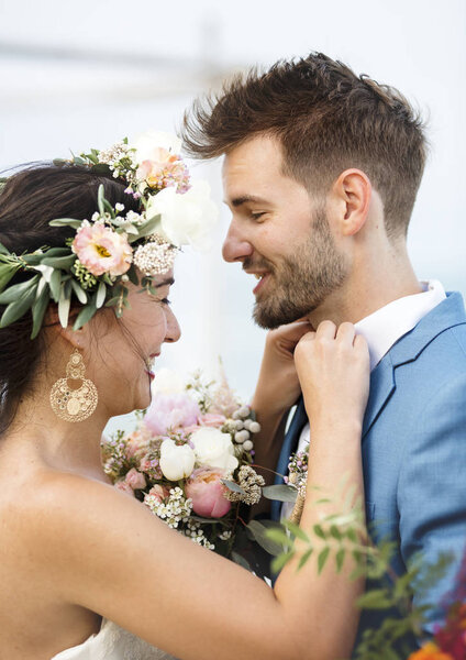 Young couple in a wedding ceremony at the beach