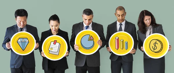 Empresários Segurando Ícones Financeiros — Fotografia de Stock