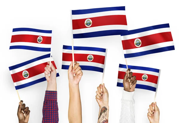 Mãos Agitando Bandeiras Costa Rica — Fotografia de Stock