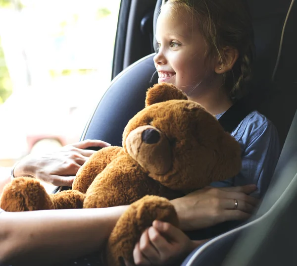 Mother Helping Put Seat Belt Little Daughter Little Girl Teddy — Stock Photo, Image