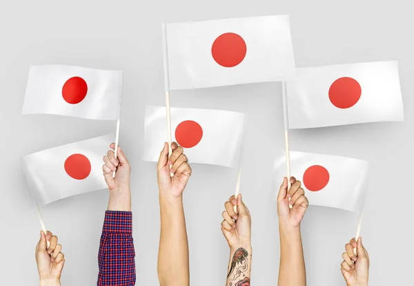 Mani Che Sventolano Bandiere Del Giappone — Foto Stock